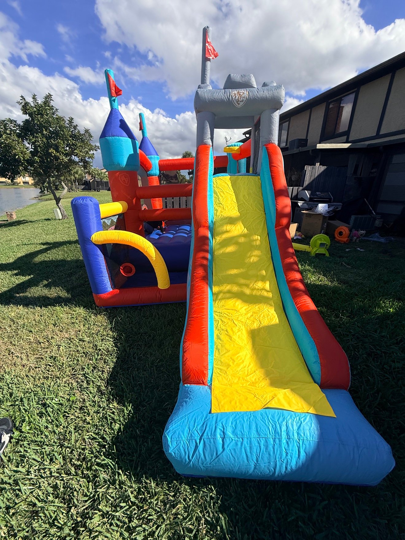 Rainbow castle combo bounce house with slide
